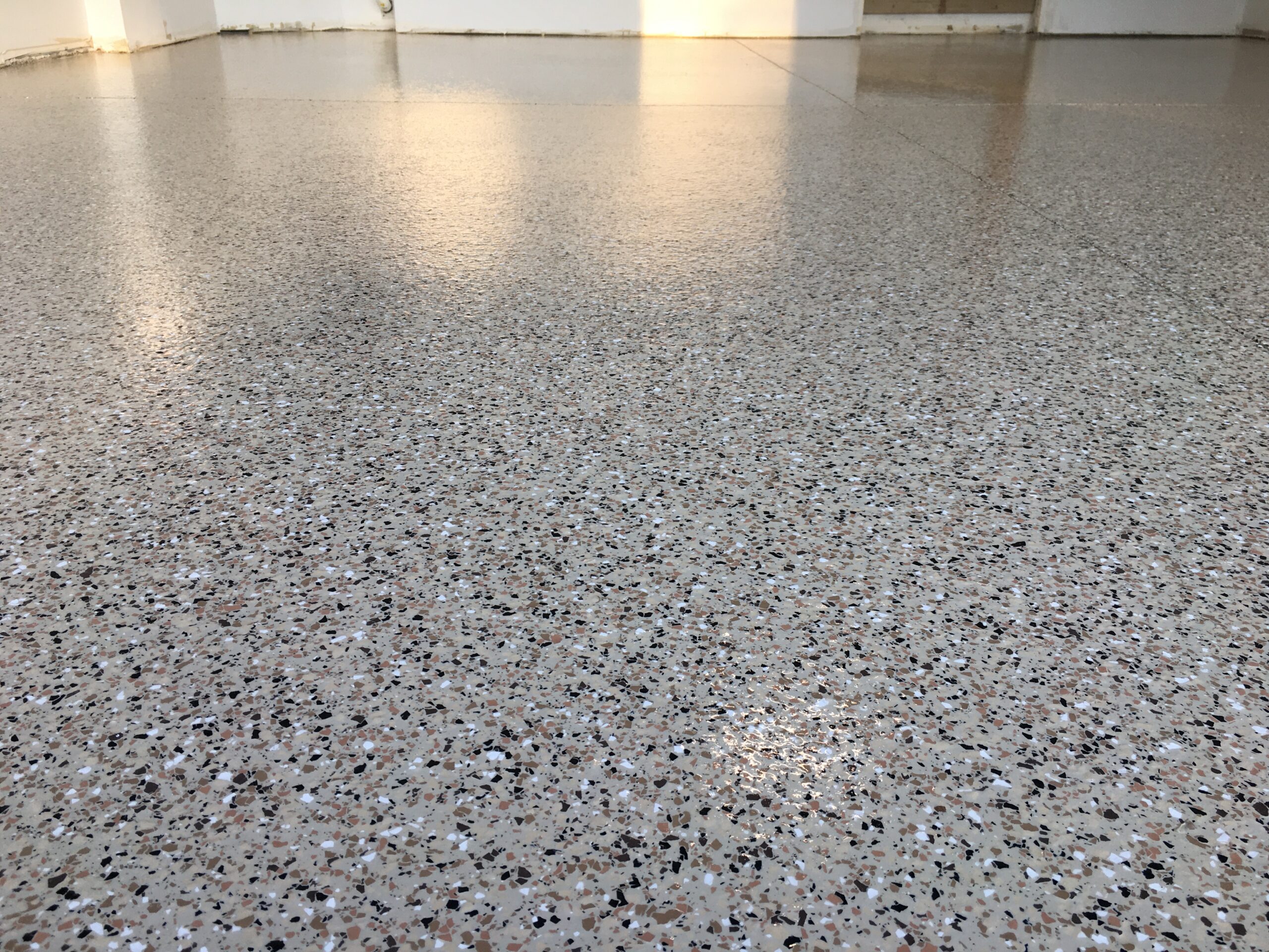 The Top Benefits of Epoxy Garage Floors: Why Grind and Coat Inc. is the Right Choice for Your Home